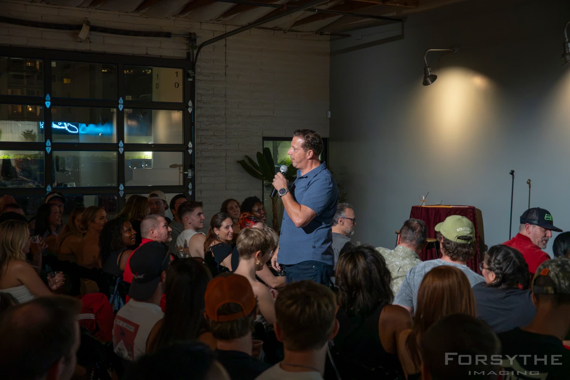 The live show in a packed industrial event space