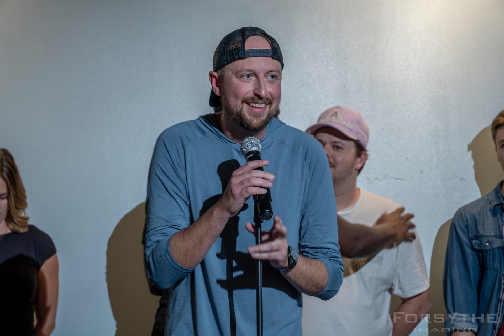 Forbes Shannon speaking candidly into a microphone